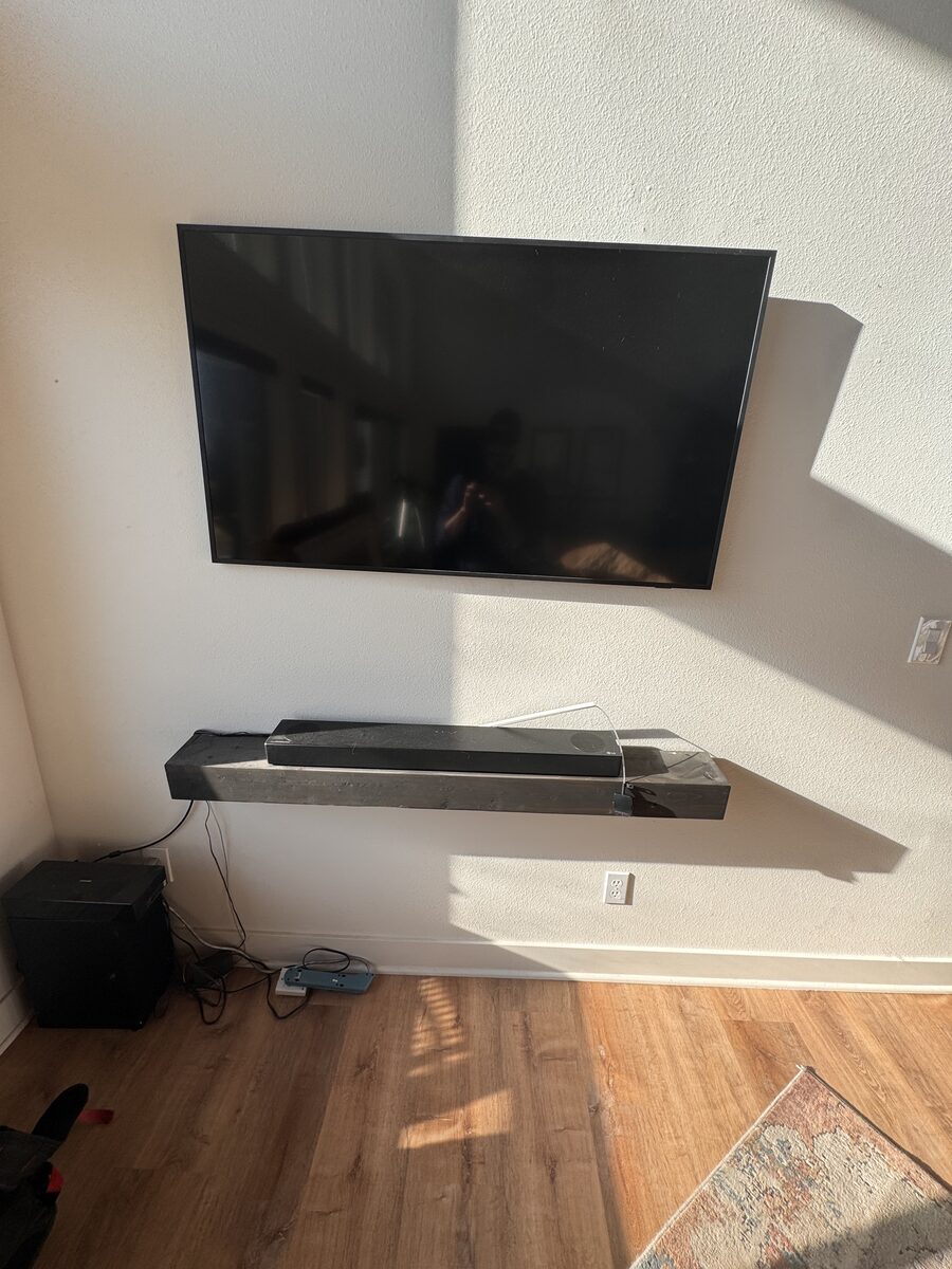Frame TV mounting in progress with soundbar and media shelf in the Treasure Valley