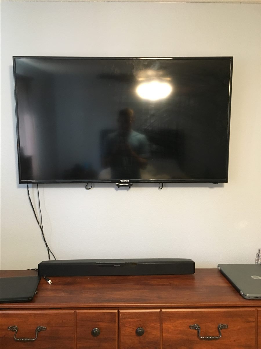 Wall mounted TV and soundbar setup for a Treasure Valley homeowner